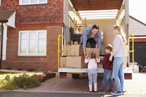 Professional movers packing household items