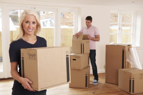 Movers efficiently unpacking items in a new home