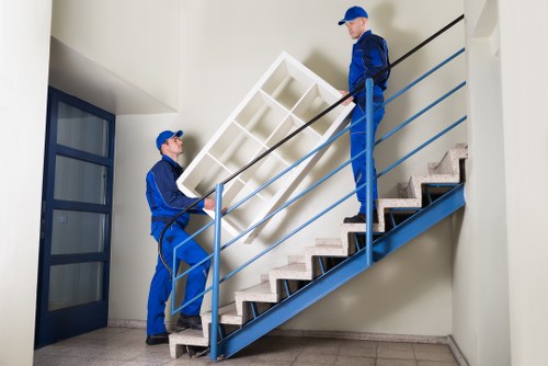 Trained movers packing and protecting furniture