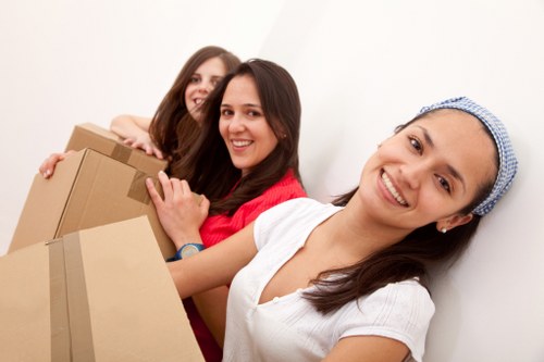 Experienced movers loading furniture onto a truck