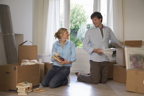 Team of house removalists packing items securely